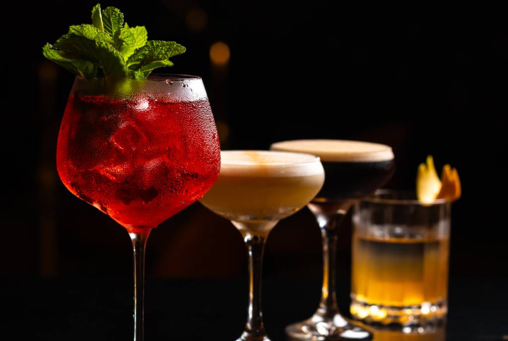Image shows a trio of cocktails. 