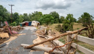 Sheds are displaced near an overpass on the banks of the Guadalupe River on July 17, 2026 in Kerrville, Texas. Flash floods swept across parts of Central Texas, bringing torrential rainfall, prompting evacuations, and triggering hundreds of water rescues. At least two people have been killed, and more than 200 others have been rescued.