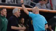 BUDAPEST, HUNGARY - MAY 31: The Referee Anthony Taylor of England shows a yellow card to Jose Mourinho Head coach of AS Roma during the UEFA Europa League 2022/23 final match between Sevilla FC and AS Roma at Puskas Arena on May 31, 2023 in Budapest, Hungary. (Photo by Jonathan Moscrop/Getty Images)