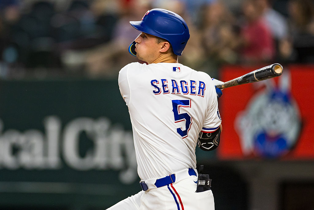 ARLINGTON, TEXAS - JUNE 06: Corey Seager #5 of the Texas Rangers follows through after hitting a single during the first inning of a game against the Cleveland Guardians at Globe Life Field on June 06, 2026 in Arlington, Texas. (Photo by John E. Moore III/Getty Images)