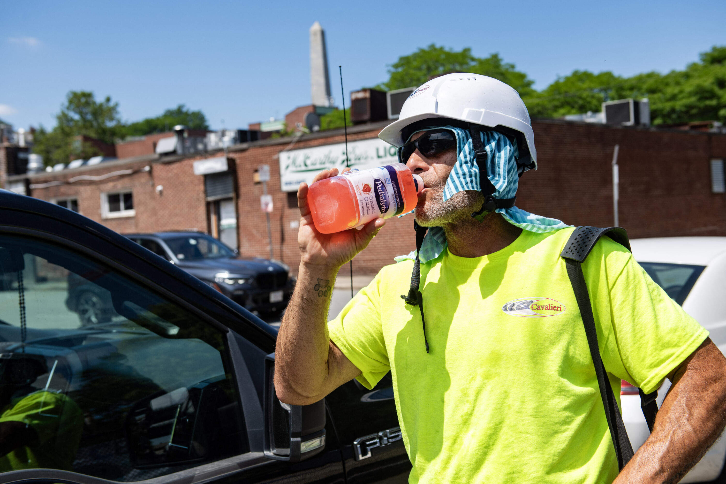 A construction worker takes a water break on Wednesday in Boston. (Joseph Prezioso/AFP via Getty Images)