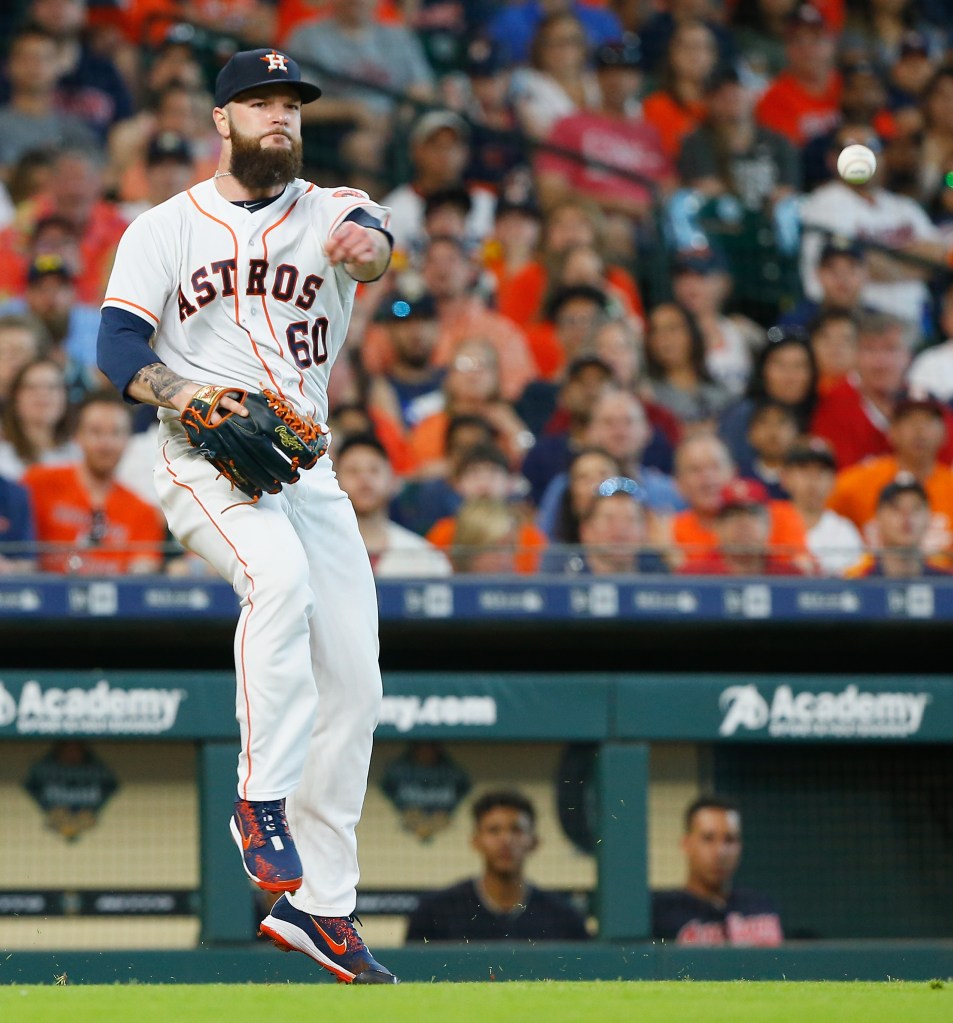 Dallas Keuchel #60 of the Houston Astros throws out Edwin Encarnacion #10 of the Cleveland Indians in the fifth inning at Minute Maid Park on May 19, 2018 in Houston, Texas. 