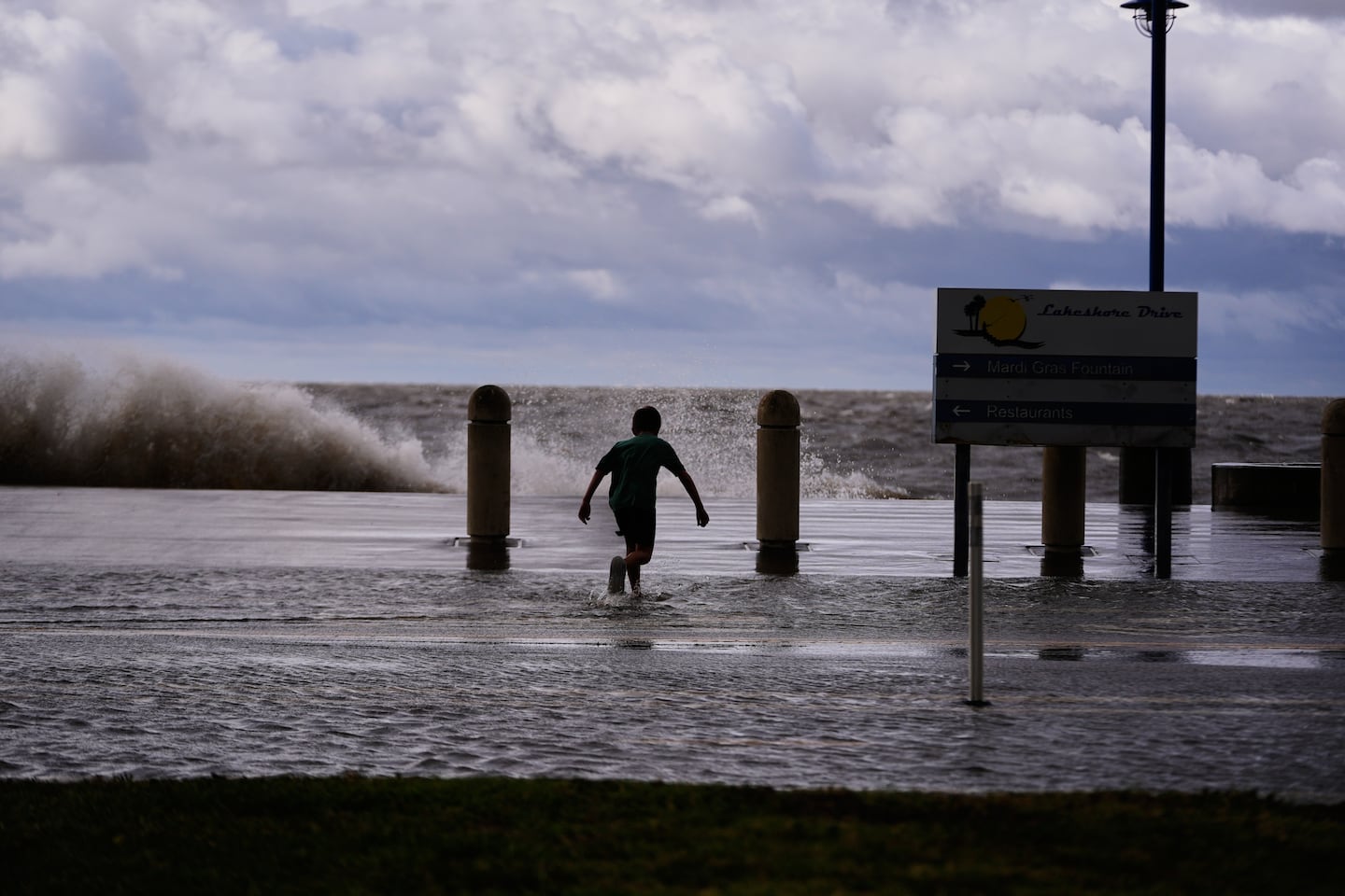 Josiah Carpenter frolics in the floodwaters on Lakeshore Drive along Lake Pontchartrain as Tropical Storm Bertha approaches the Louisiana Coast on July 22, in New Orleans.