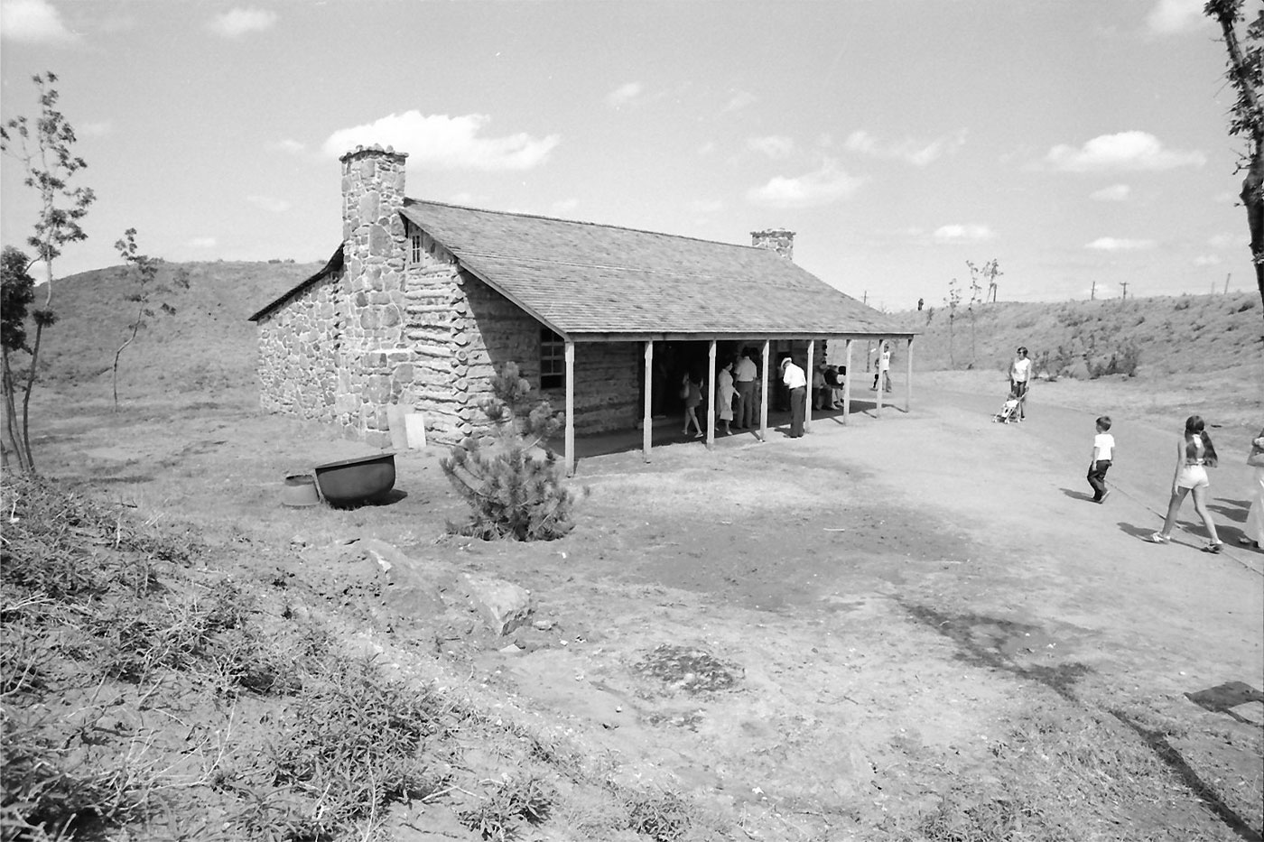 Visitors at historic structure on NRHC grounds