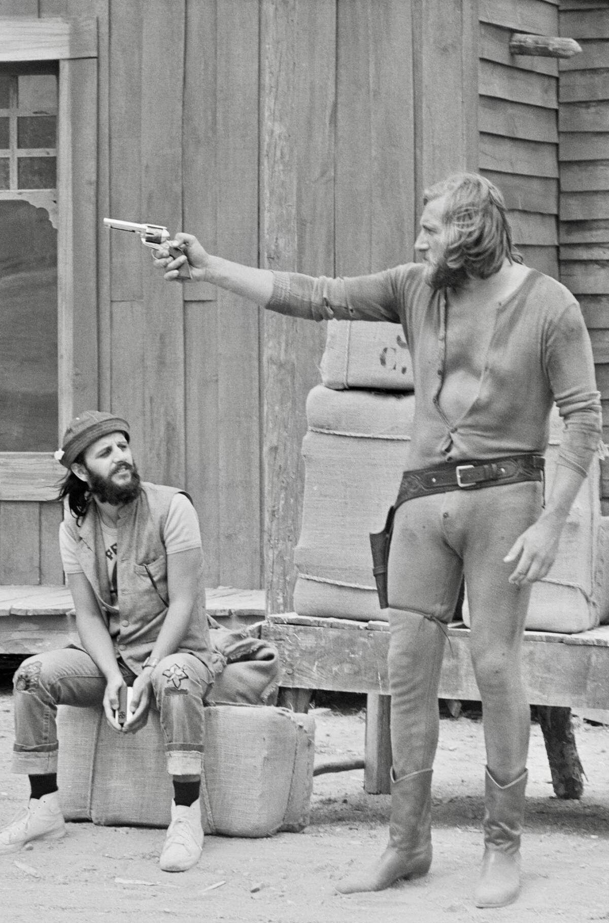 English musician Ringo Starr, left, then the drummer with The Beatles, with actor Mal Evans on the set of the spaghetti western “Blindman.” filmed in Almeria, Spain, July 14, 1971.