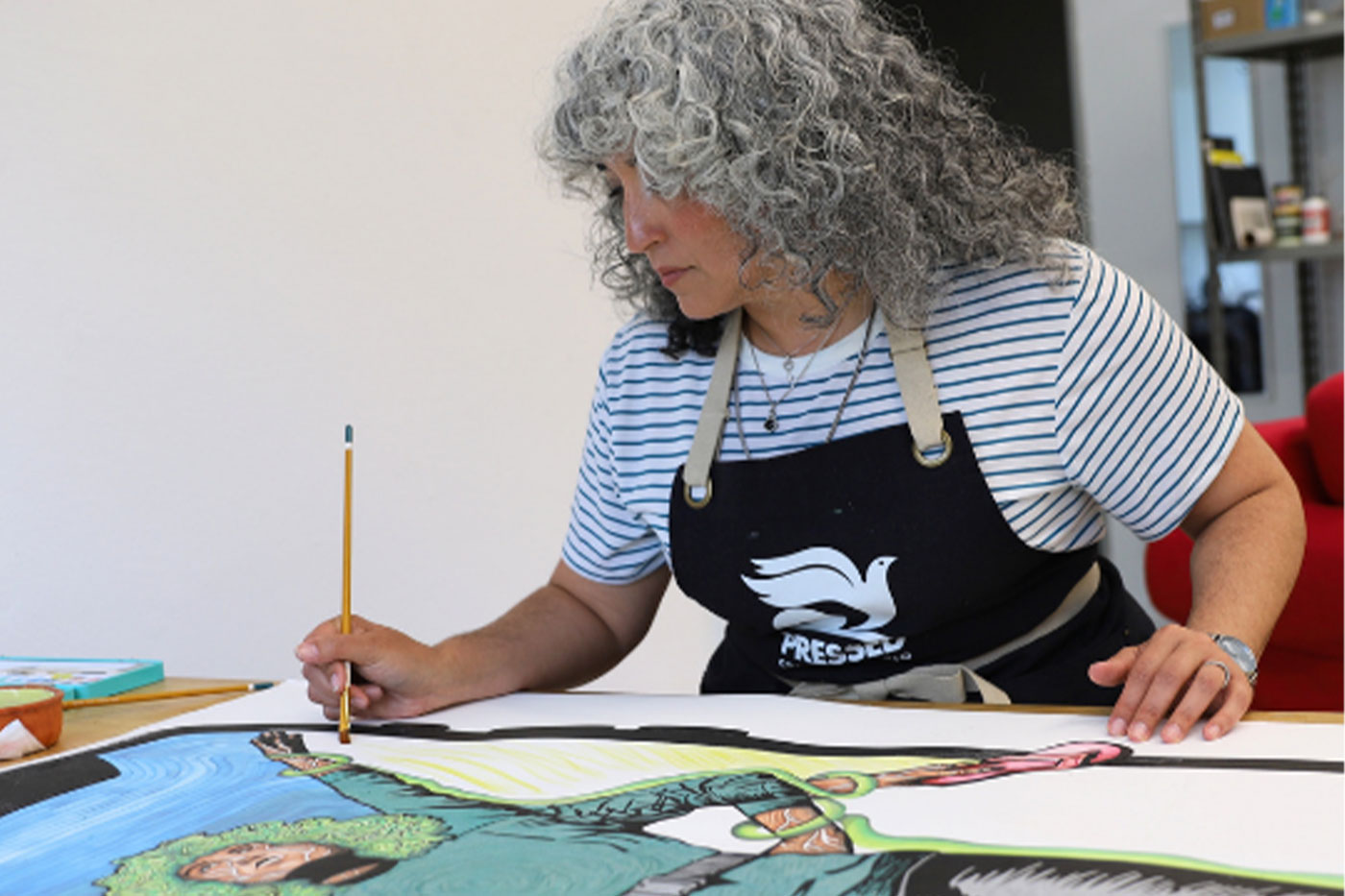 Brandy Gonzáles working in art studio