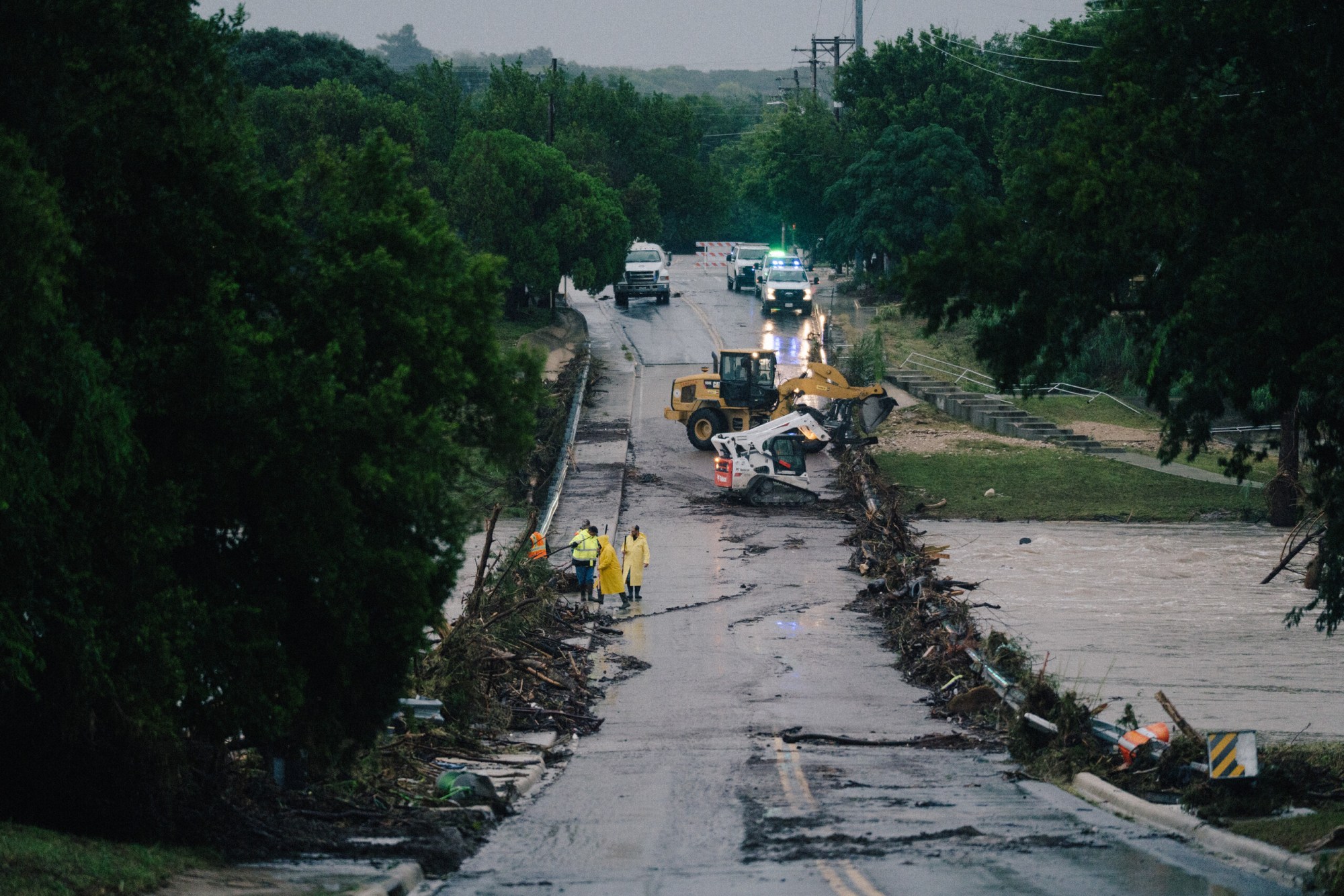 First responders on a bridge covered by water after the flood in Kerrville on July 16, 2026.