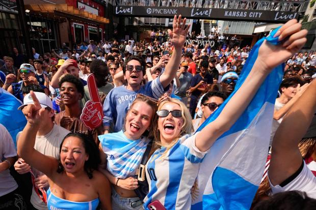 Fans cheer after an Argentina goal during a watch party for a World Cup semifinal soccer match between Argentina and England at the KC Live! entertainment district Wednesday, July 15, 2026, in Kansas City, Mo. (AP Photo/Charlie Riedel)