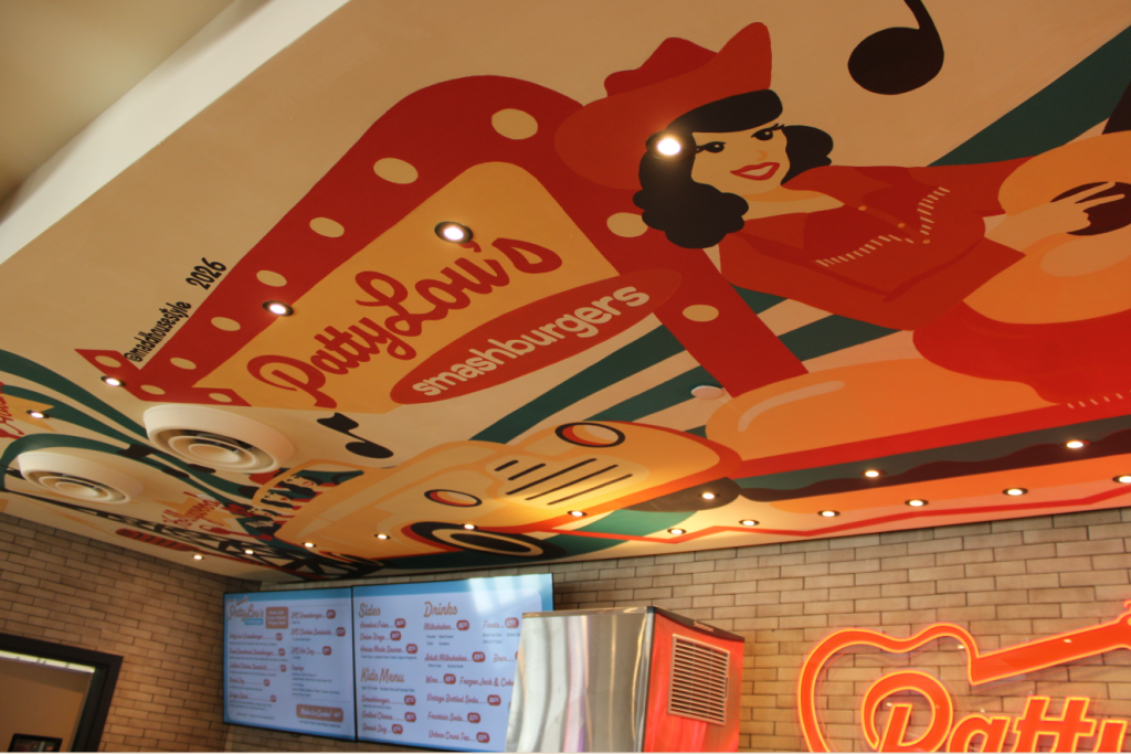 Patty Lou's mural featuring motifs of her career including stops on Route 66 and Longhorn Ballroom.