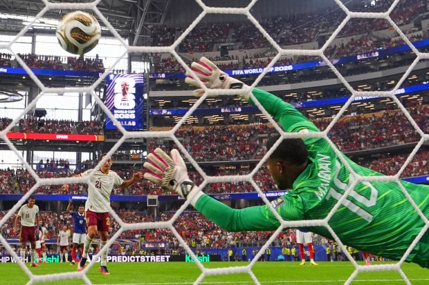 Spain's Mikel Oyarzabal (21) scores their first goal on a penalty kick past France goalkeeper Mike Maignan (16) during the World Cup semifinal soccer match between France and Spain in Arlington, Texas, near Dallas, Tuesday, July 14, 2026. (AP Photo/Julio Cortez)