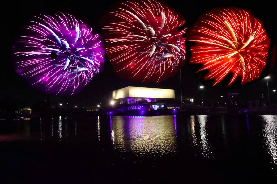 Image shows fireworks going off over the National Medal of Honor Museum in Arlington, Texas. 