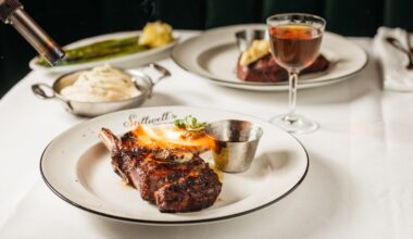 a steak being torhced on a plate at Stillwell's