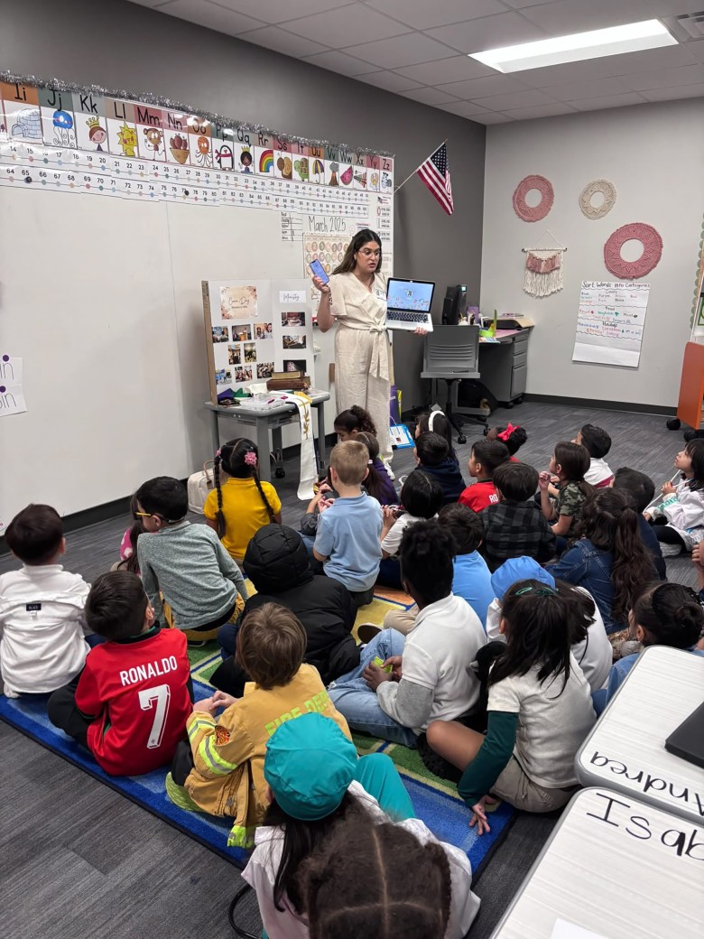 The Rev. Rosedanny Ortiz speaks to an elementary school class about her job in ministry.
