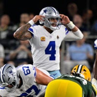 Sep 28, 2025; Arlington, Texas, USA; Dallas Cowboys quarterback Dak Prescott (4) motions to his team during the game between the Dallas Cowboys and the Green Bay Packers at AT&T Stadium.