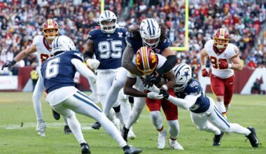 Dec 25, 2025; Landover, Maryland, USA; Dallas Cowboys linebacker Marist Liufau (35) and safety Malik Hooker (28) tackle Washington Commanders running back Jacory Croskey-Merritt (22) in the third quarter at Northwest Stadium.