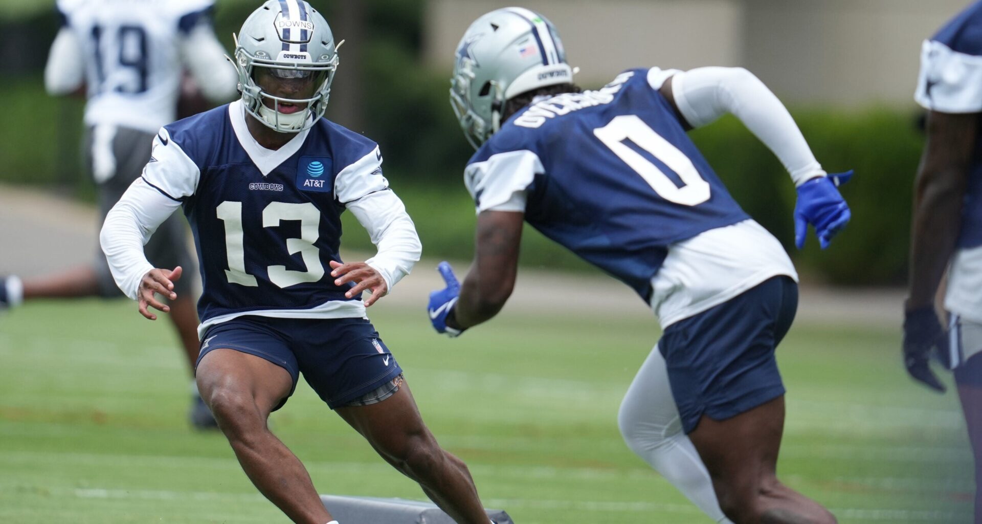Jun 16, 2026; Dallas, TX, USA; Dallas Cowboys safety Caleb Downs (13) and linebacker DeMarvion Overshown (0) go through a drill during practice at the Ford Center at the Star Training Facility in Frisco, Texas.