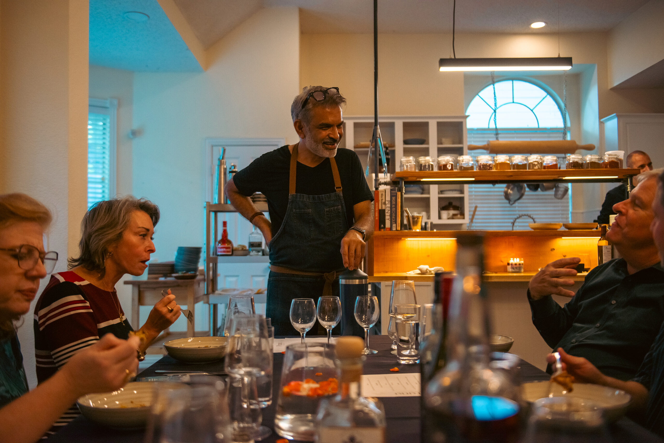 Chef Vijay Sadhu chats with supper club guests.