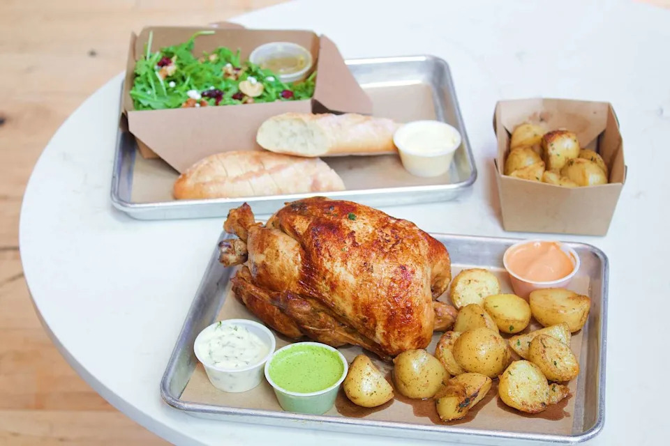 The family meal at Austin Rotisserie serves a whole chicken with potatoes and salad. (Sara Lauren Hinojosa/Provided by Austin Rotisserie)