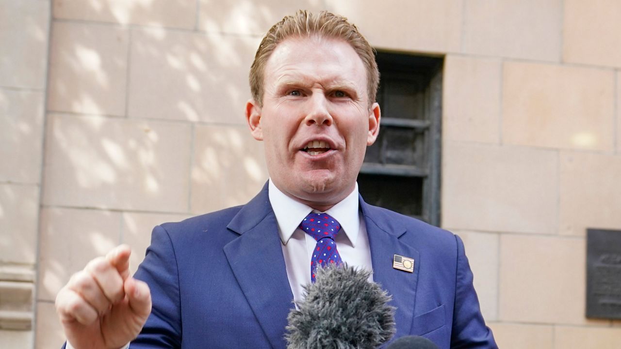 Andrew Giuliani, son of former New York Mayor Rudy Giuliani, speaks to reporters outside the building where his father lives, Wednesday, April 28, 2021, in New York. (AP Photo/Mary Altaffer)