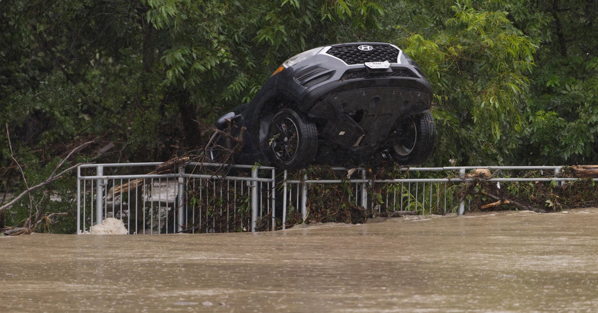 Floods surge in Texas Hill Country after huge rainstorms, as rescuers pull people from rising waters