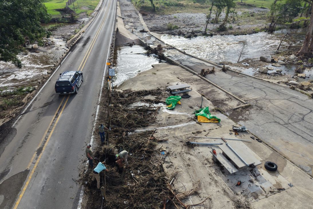 Debris from flash floods is piled up close to the Guadalupe River in Hunt, Texas on Saturday, July 18.