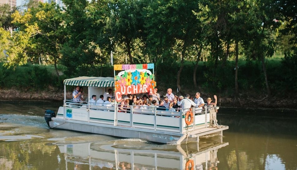Image shows the Cuchara Xochimilco boat tour on Buffalo Bayou in Houston. 