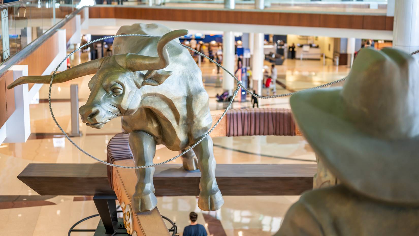 Statue of a cowboy running cattle at the Dallas-Fort Worth International Airport (DFW)