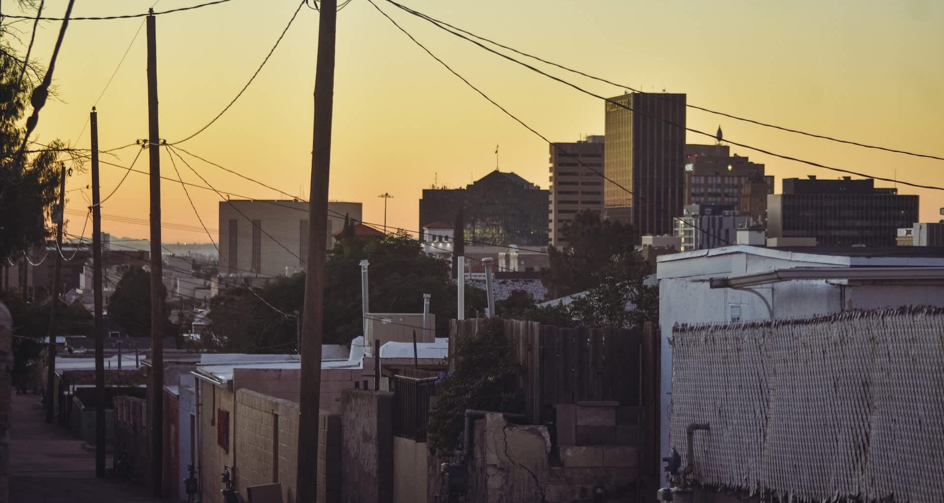 An alley lined with utility poles.