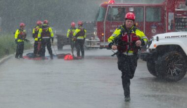 Texas flooding surges from huge rainstorms as rescuers pull people from rising waters