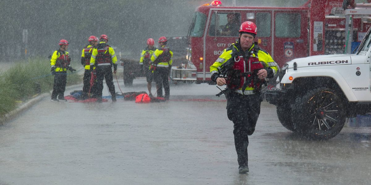 Texas flooding surges from huge rainstorms as rescuers pull people from rising waters
