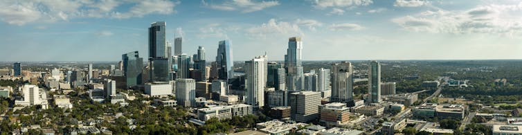 An aerial view of downtown Austin, Texas, with high-rise towers