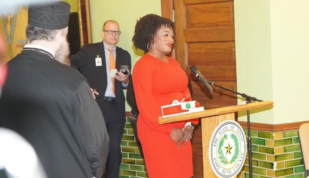 Fort Bend County Attorney Bridgette Smith Lawson stands behind a podium