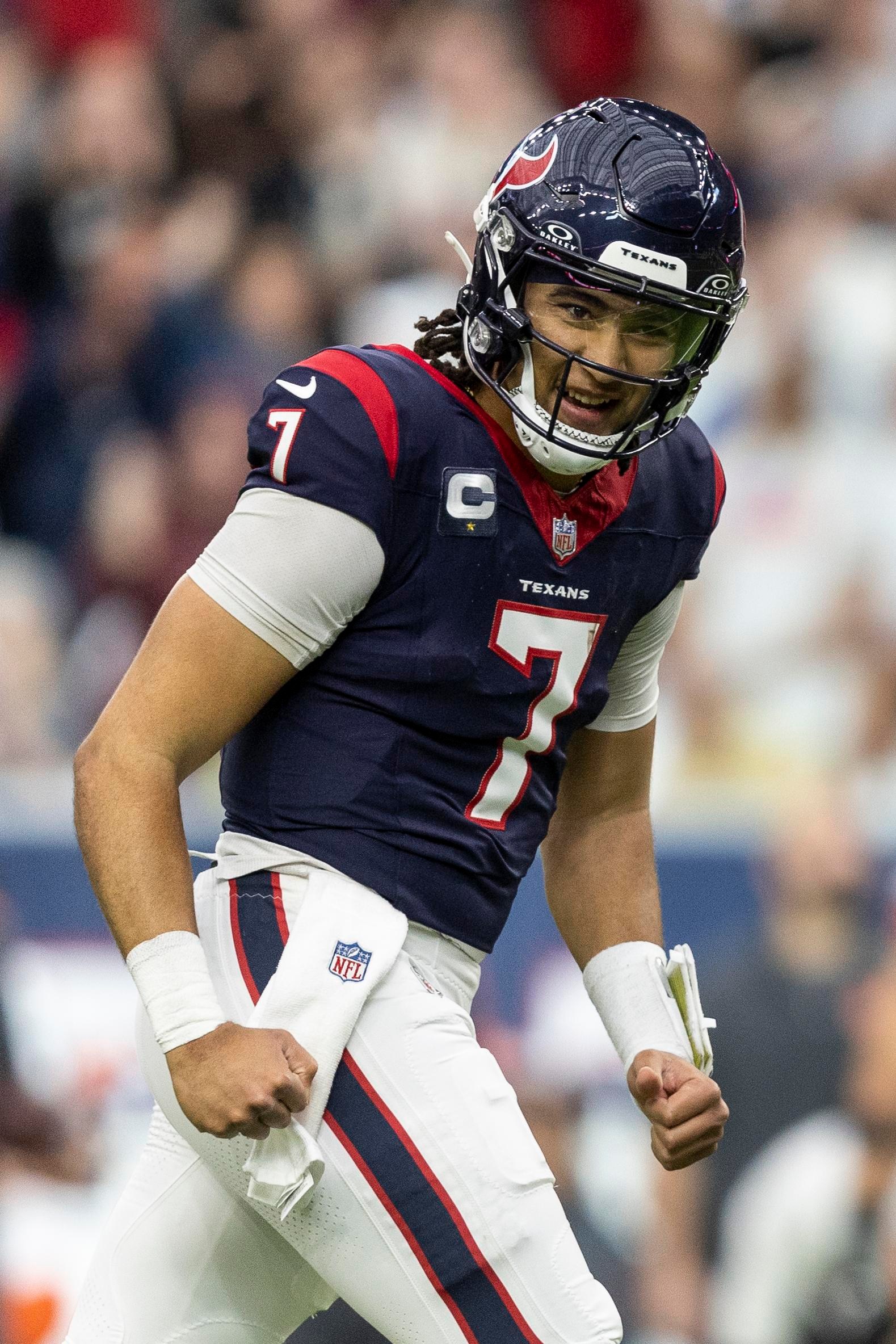 HOUSTON, TEXAS - JANUARY 13: C.J. Stroud #7 of the Houston Texans celebrates after a touchdown during an NFL wild-card playoff football game between the Houston Texans and the Cleveland Browns at NRG Stadium on January 13, 2024 in Houston, Texas. (Photo by Michael Owens/Getty Images)