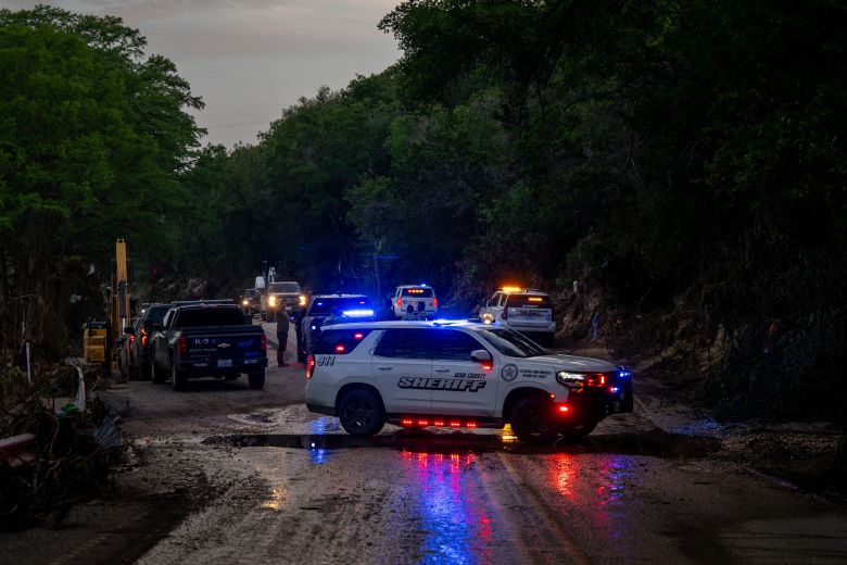 Law enforcement work to retrieve deceased people near Camp Mystic on July 7, 2025 in Hunt, Texas. Severe flash flooding along the Guadalupe River left more than 100 people dead, including children attending the camp.
