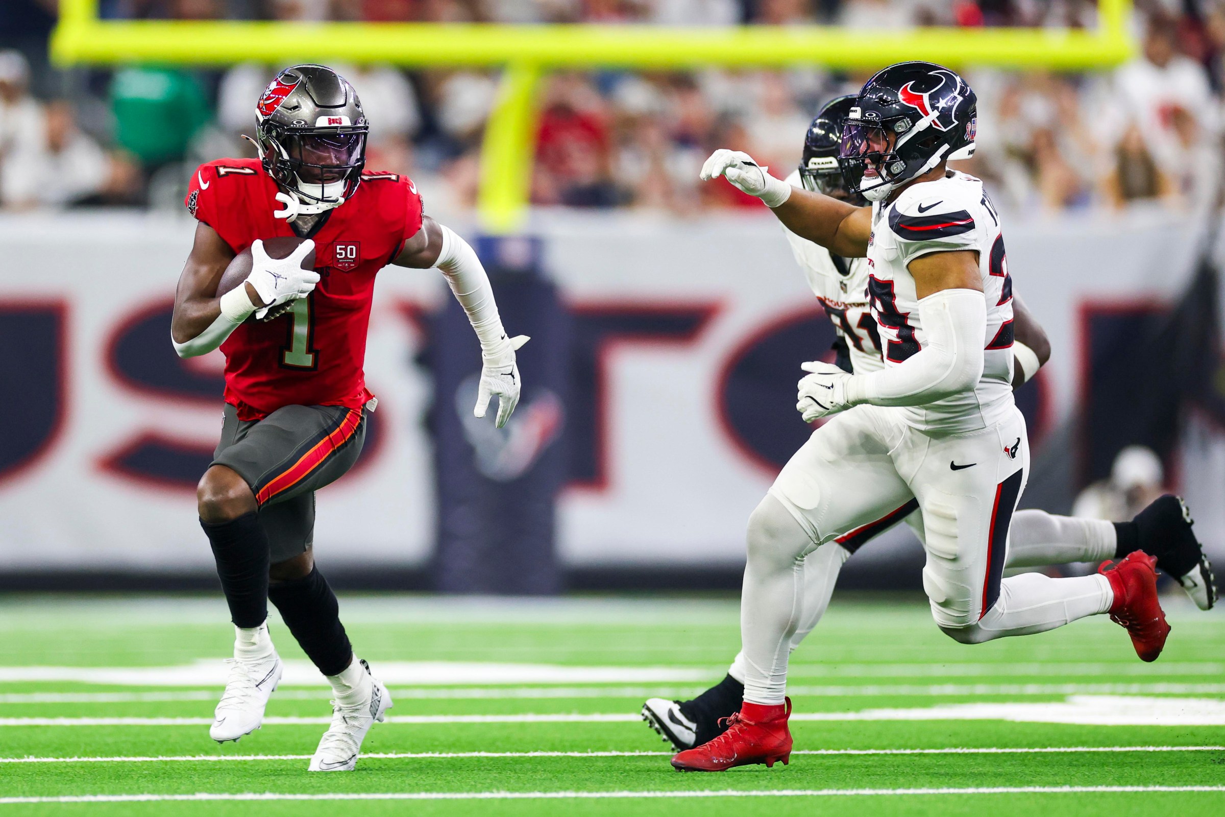 HOUSTON, TEXAS - SEPTEMBER 15: Rachaad White #1 of the Tampa Bay Buccaneers runs the ball during an NFL football game against the Houston Texans at NRG Stadium on September 15, 2025 in Houston, Texas. (Photo by Logan Bowles/Getty Images)