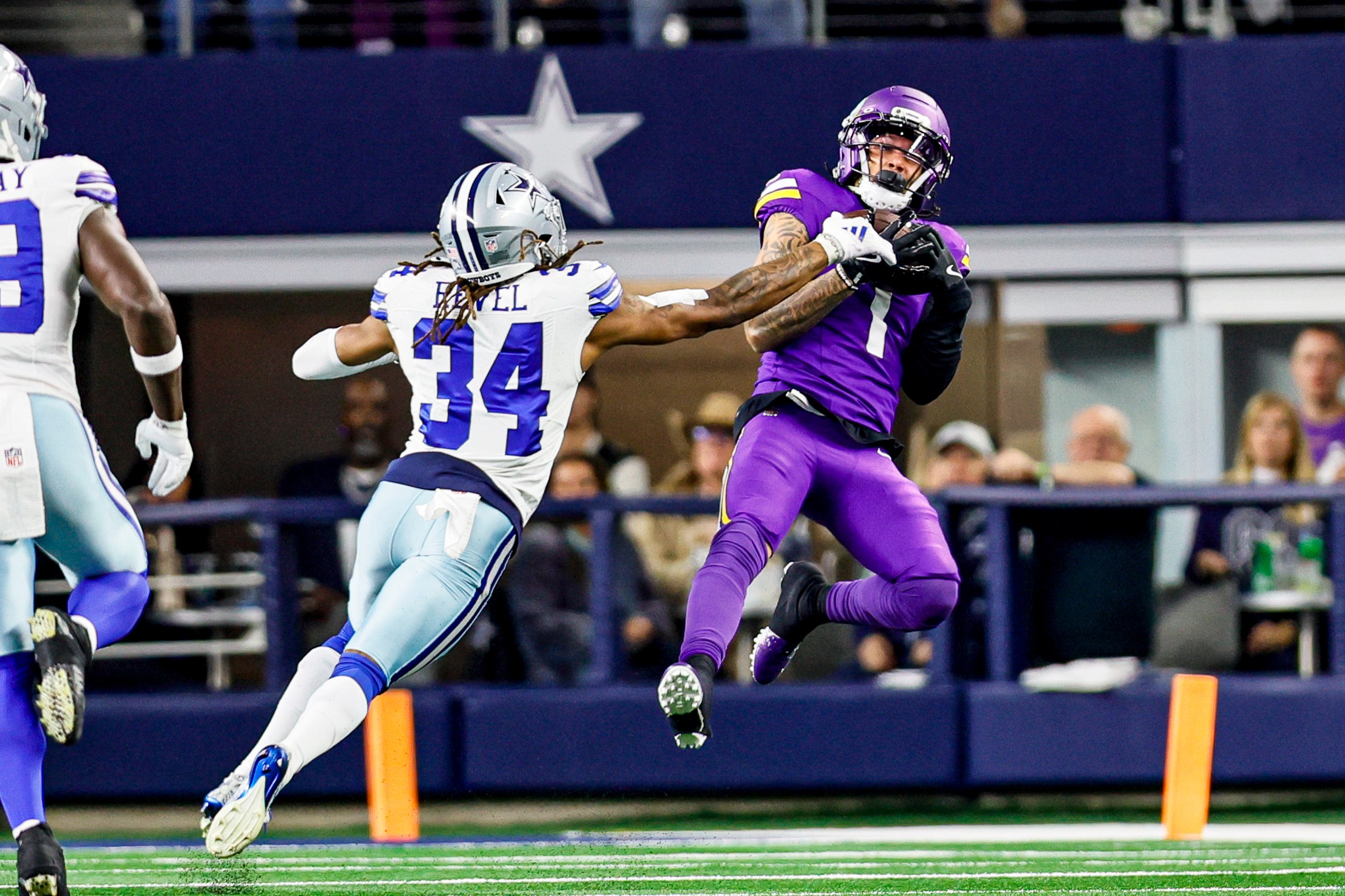 ARLINGTON, TX - DECEMBER 14: Minnesota Vikings wide receiver Jalen Nailor (1) catches a pass for a first down over Dallas Cowboys cornerback Shavon Revel Jr. (34) during the game between the Dallas Cowboys and the Minnesota Vikings on December 14, 2025 at AT&T Stadium in Arlington, Texas. (Photo by Matthew Pearce/Icon Sportswire via Getty Images)