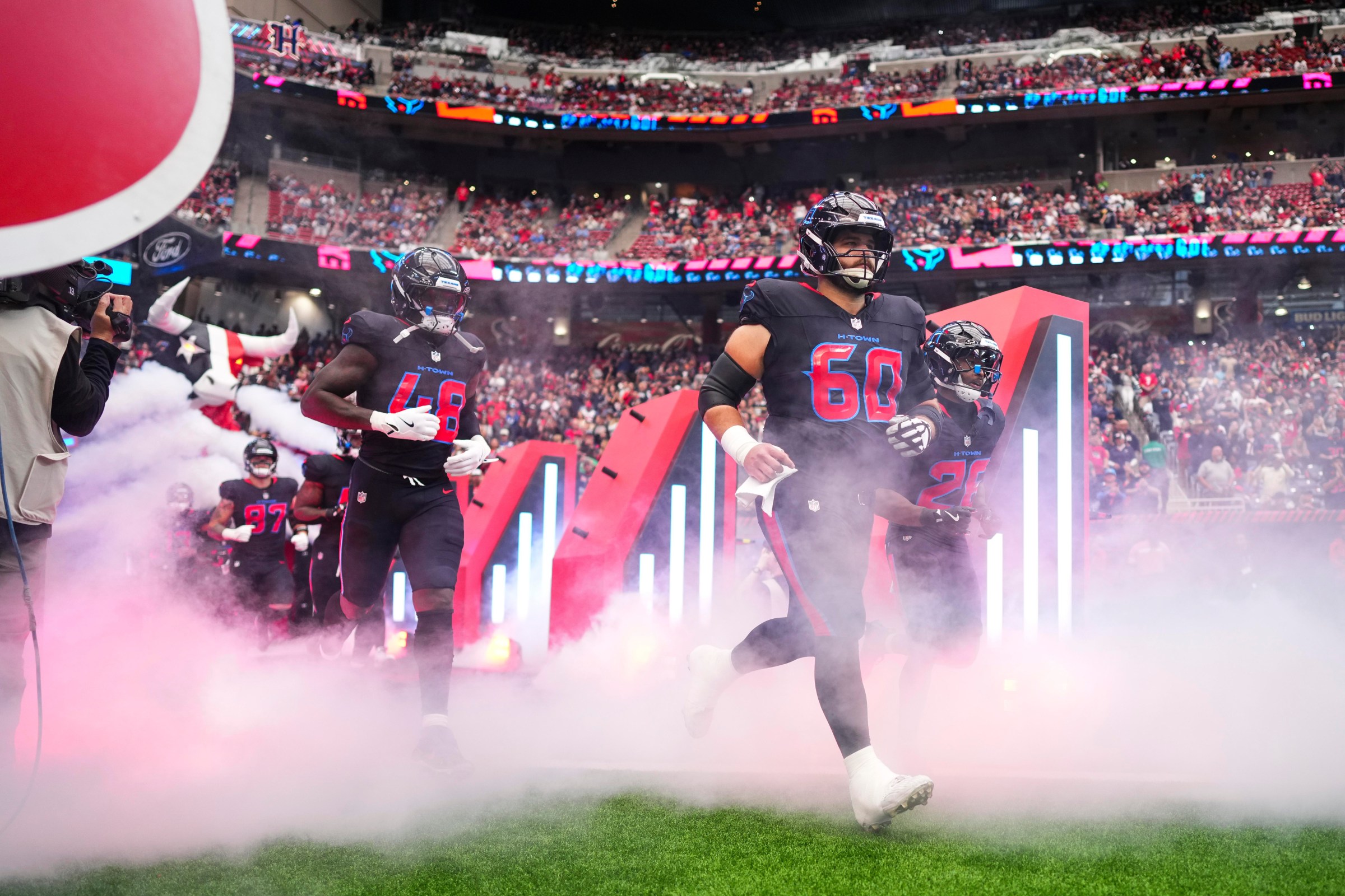 HOUSTON, TX - JANUARY 04: Jake Andrews #60 of the Houston Texans runs out of the tunnel prior to an NFL football game against the Indianapolis Colts at NRG Stadium on January 4, 2026 in Houston, Texas. (Photo by Cooper Neill/Getty Images)