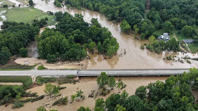 The Black River overflows near a bridge on Route 21 due to flash flooding in Centerville, Mo., and the surrounding region on Friday, July 10, 2026.