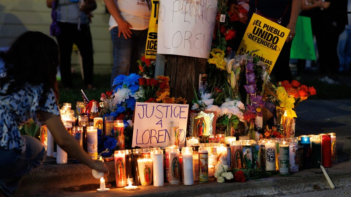 Candles are lit during a vigil for Lorenzo Salgado Araujo