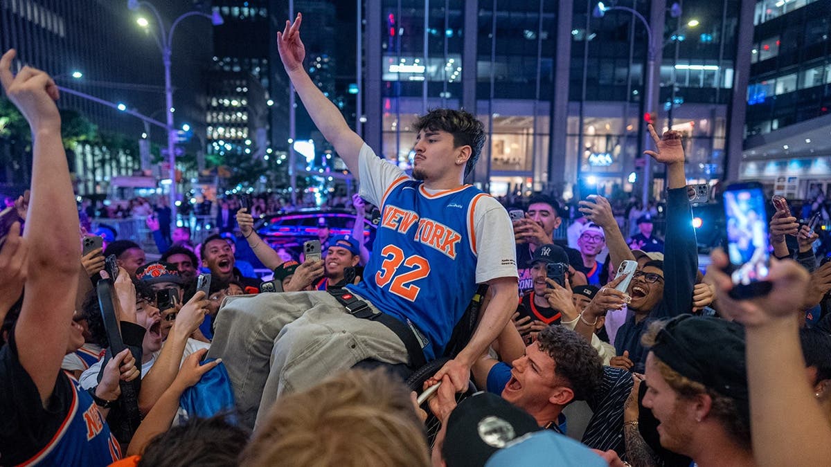 Knicks fans celebrating in New York City after winning eastern conference championship