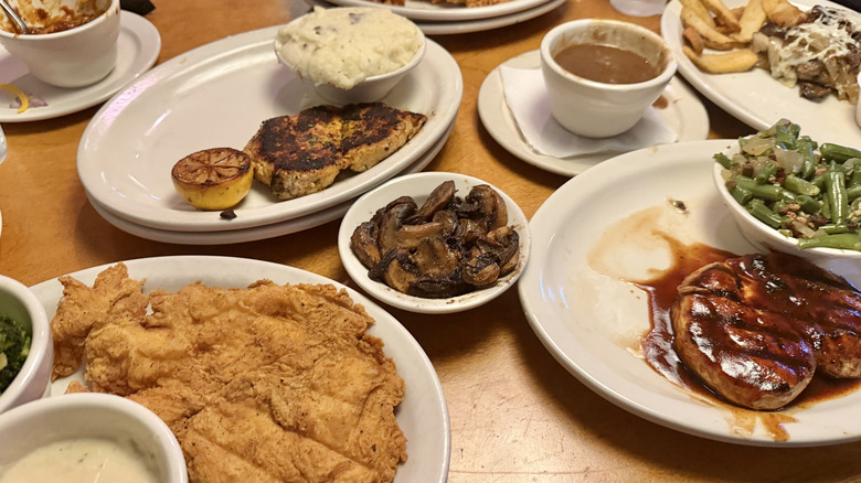 Various chicken dishes from Texas Roadhouse on a table