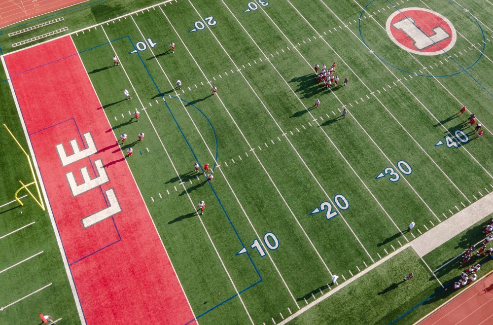 The LEE High School football team practices on Wednesday.