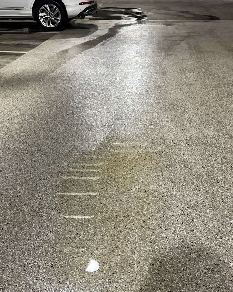 photo of yellow liquid on garage floor