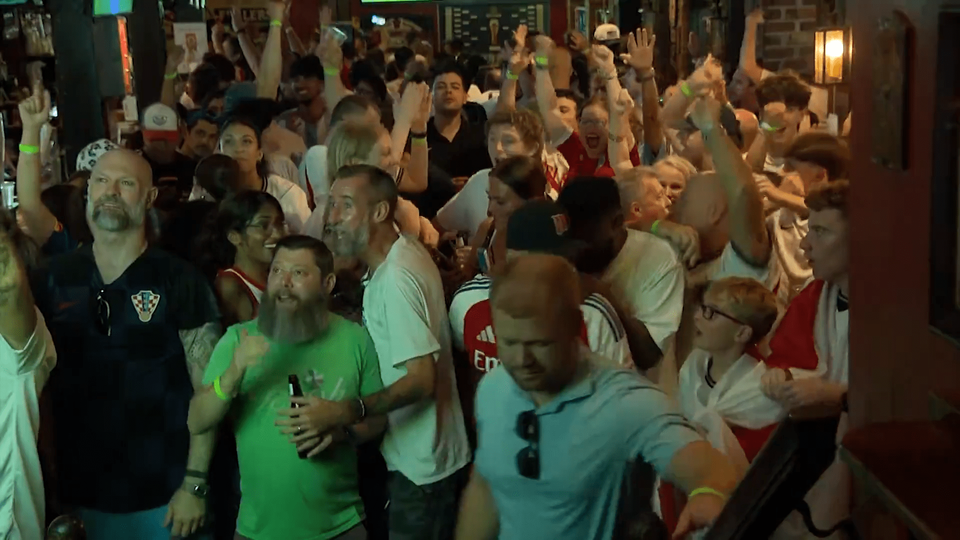 England fans celebrate one of their four goals against Croatia at Dallas' Londoner Pub's World Cup watch party. The Londoner reached capacity as supporters cheered England's 4-2 win.