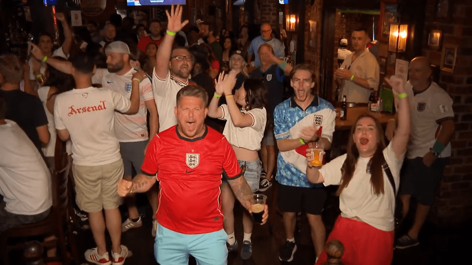 Fans celebrate one of the six goals at Dallas' Londoner Pub's World Cup watch party. The Londoner reached capacity as supporters cheered England's 4-2 win.
