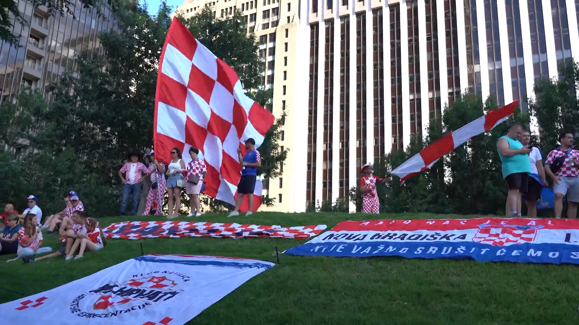 Croatia fans march in Downtown Dallas with a supporter flag. Fans celebrated with parties, parades, and plenty of team spirit. Croatia lost the game against England 4-2.