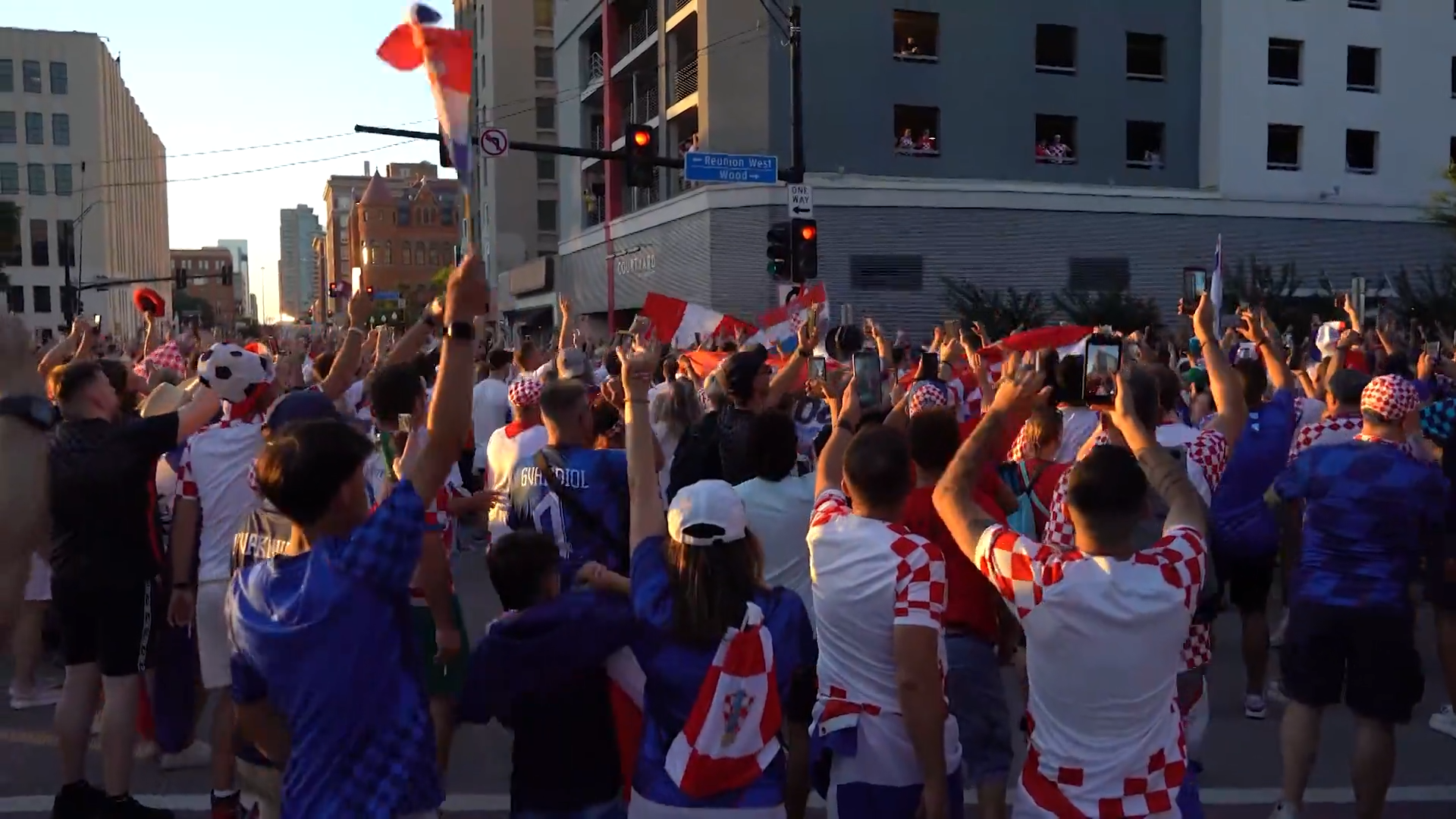 Croatia fans march in Downtown Dallas with a supporter flag. Fans celebrated with parties, parades, and plenty of team spirit. Croatia lost the game against England 4-2.