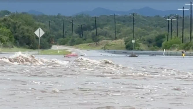 Floodwaters renders road impassable outside Camp Wood, Texas on July 15, 2026.