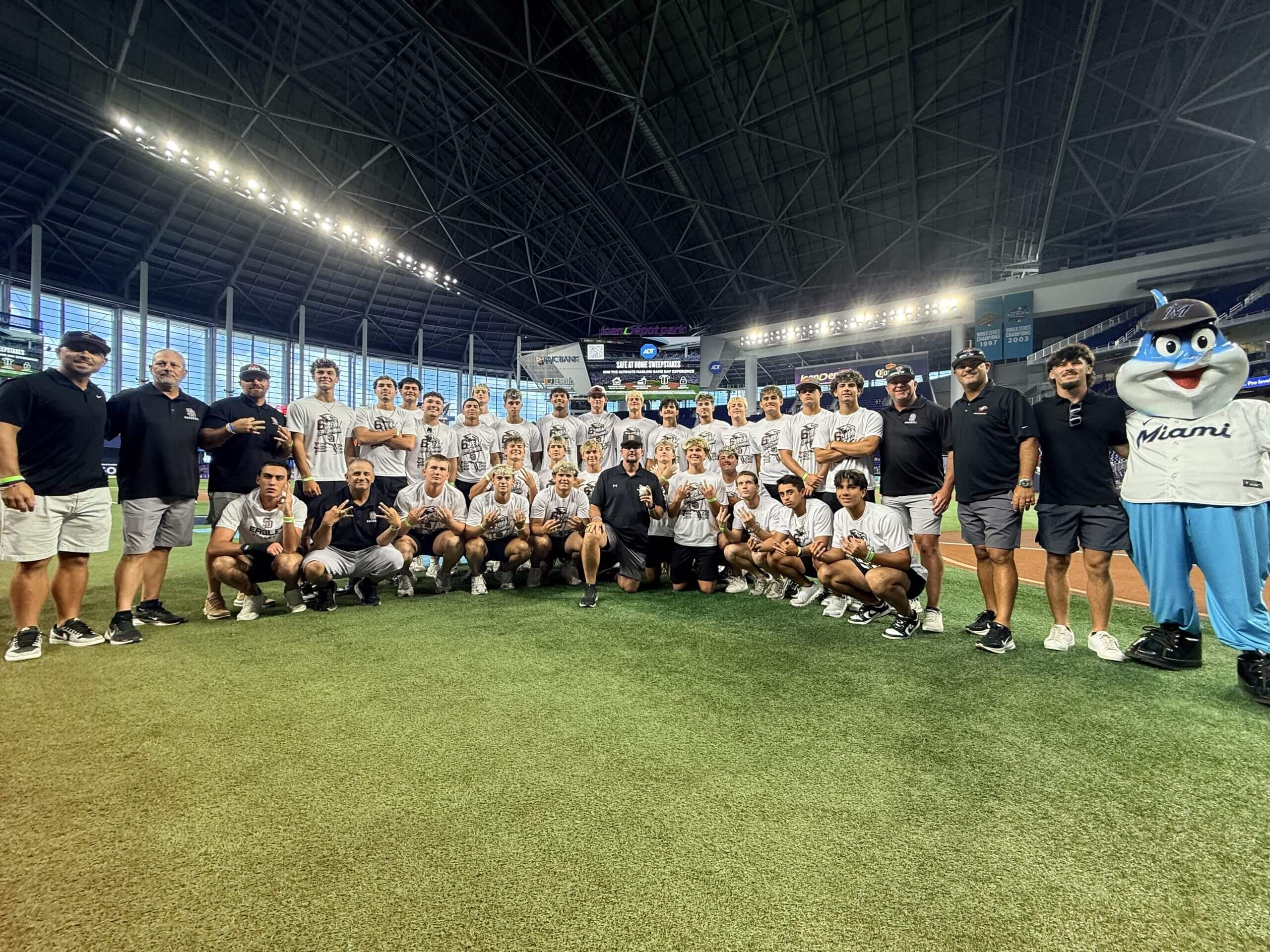 Todd Fitz-Gerald (center) poses with his Stoneman Douglas team at loanDepot Park in Miami. Stoneman Douglas High School / Courtesy of Todd Fitz-Gerald