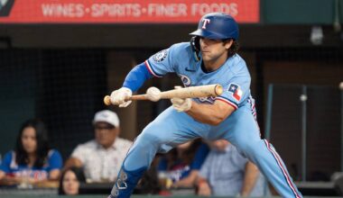 Apr 26, 2026; Arlington, Texas, USA;  Texas Rangers shortstop Josh Smith (8) lays down a bunt single during the sixth inning against the Athletics at Globe Life Field. Mandatory Credit: Raymond Carlin III-Imagn Images